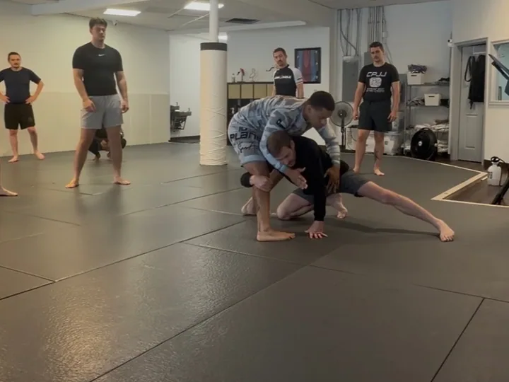 Two adults working a takedown during an open mat at Clayton Phillips Jiu Jitsu